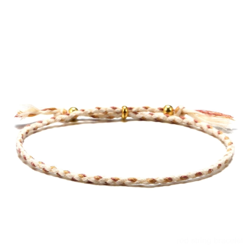 Handmade Tibetan braided rope tassel bracelet in beige neutral tone with gold spacer beads