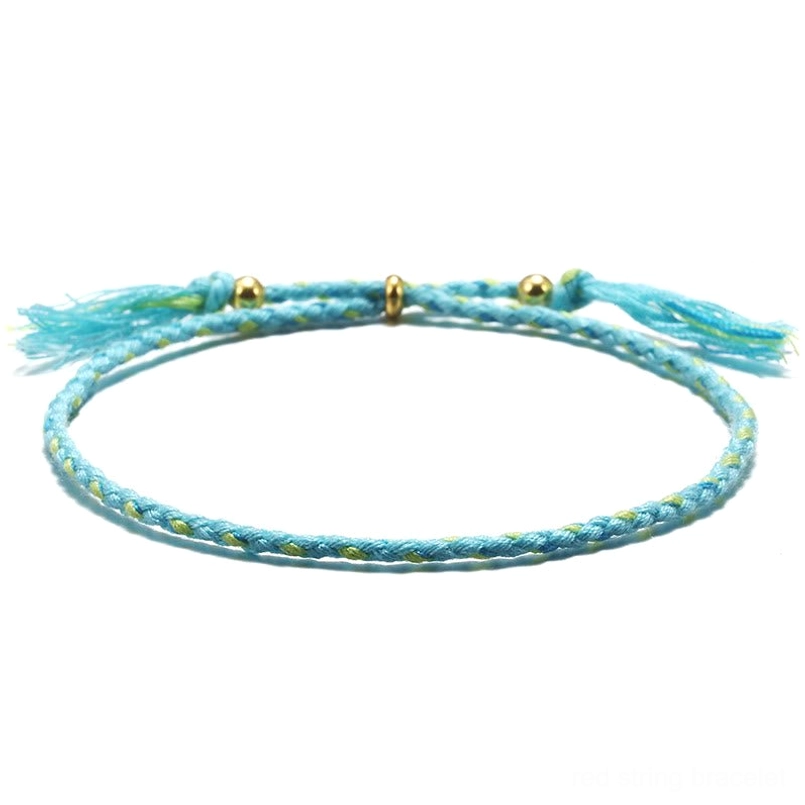 Handmade Tibetan braided rope tassel bracelet in pure blue for healing and inner peace