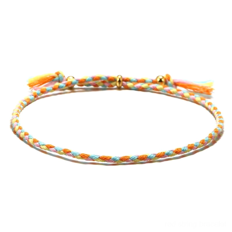 Handmade Tibetan braided rope tassel bracelet in pastel rainbow mixed colors with frayed tassel
