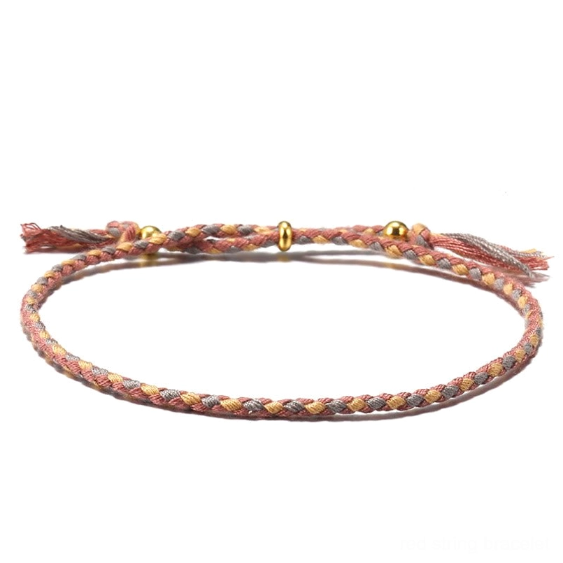 Handmade Tibetan braided rope harmony bracelet in earthy brown tones with decorative frayed tassel