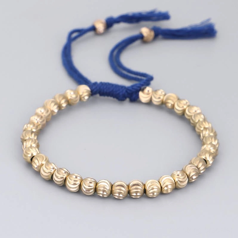 Blue string tibetan copper bead bracelet handmade with tassel ends