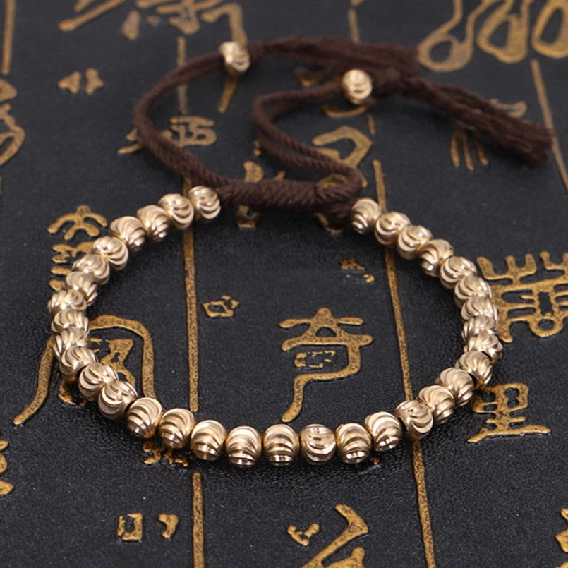 Tibetan copper bead protection bracelet shown with spiritual meaning infographic
