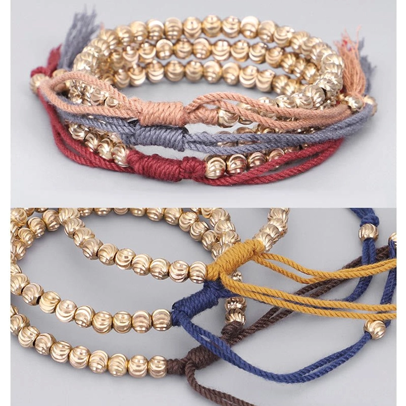Tibetan copper bead red string bracelet lifestyle wear example on wrist