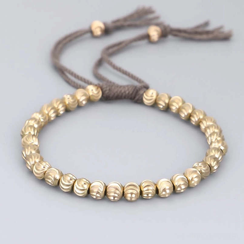 Dark grey tibetan copper bead bracelet handmade with ridged gold beads