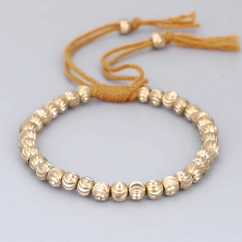 Orange cotton string tibetan handmade copper bead prosperity bracelet