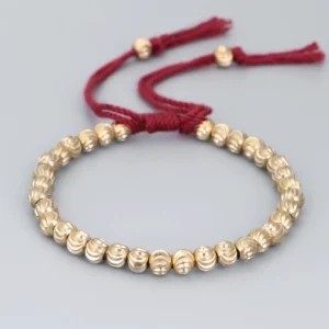 Red string tibetan handmade copper bead bracelet with adjustable tassel closure