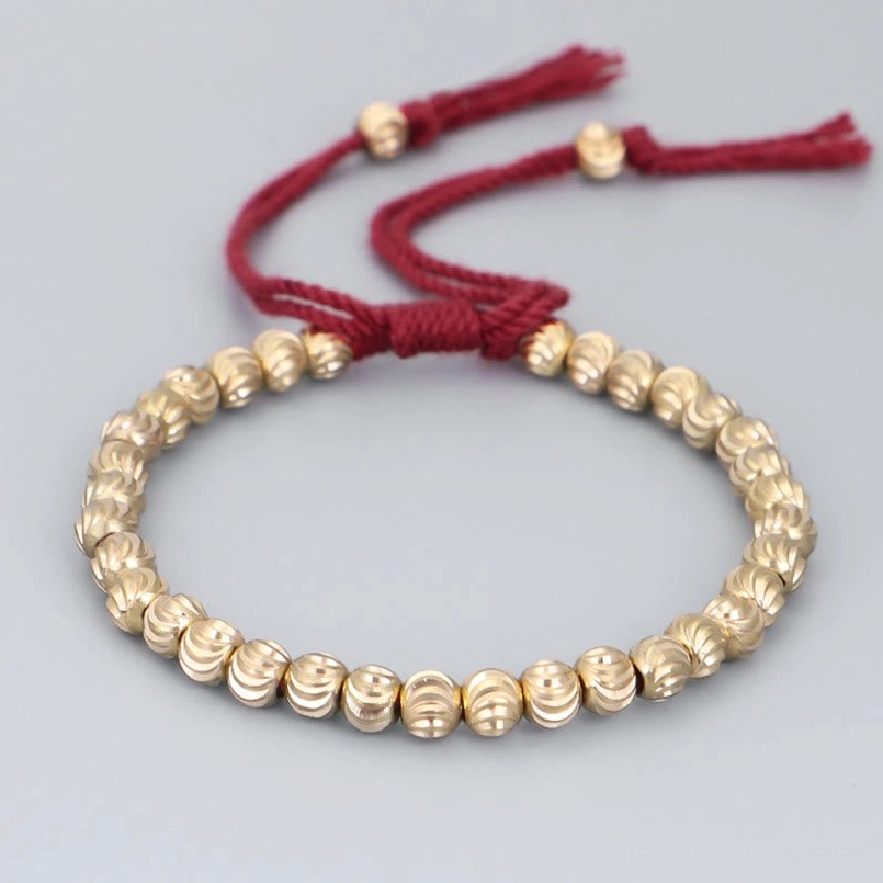 Red string tibetan handmade copper bead bracelet with adjustable tassel closure