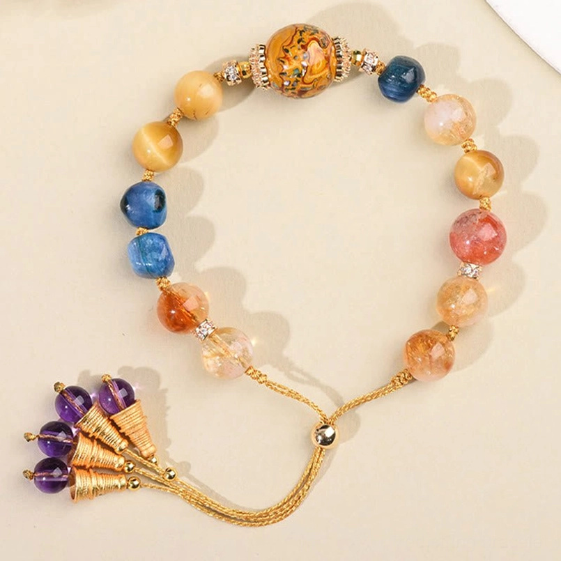 Handwoven energy bracelet with purple tassel clasp displayed in circular arrangement