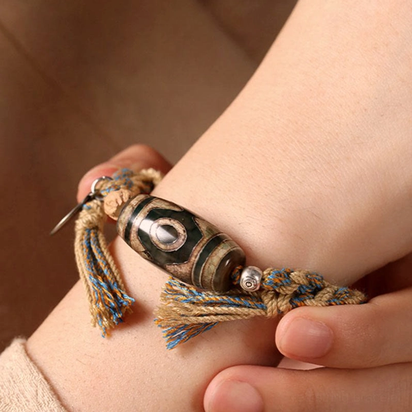 Wearing Tibetan Dzi Bead bracelet on wrist close-up adjustable sizing