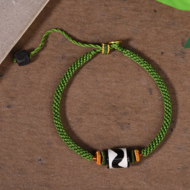 Green braided rope Tibetan Dzi bead bracelet with tiger stripe pattern and adjustable design