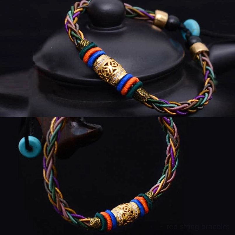 Eight knot tibetan bracelet with copper coin and carved metal accents