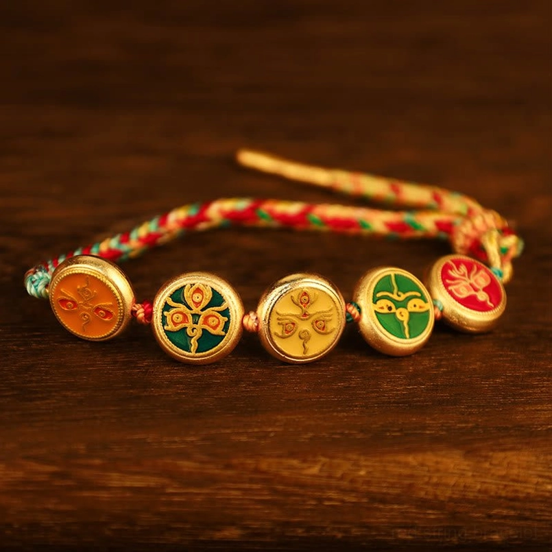 Tibetan Five Gods of Wealth pull rope bracelet flat lay with adjustable braided ends and colorful woven design