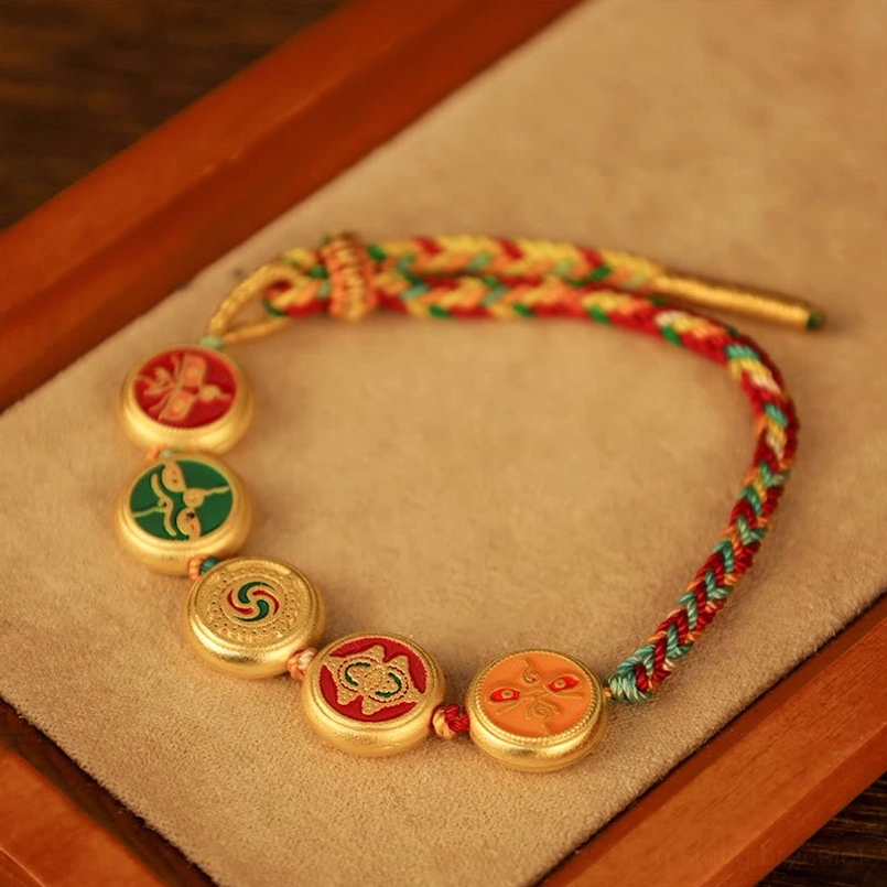 Five Gods of Wealth Tibetan braided bracelet unboxing showing multicolor rope and enamel charm collection
