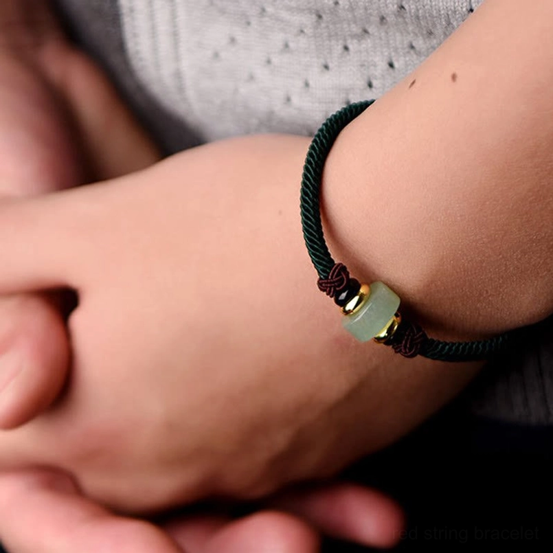 Tibetan green aventurine protection bracelet with braided red cord and gold toggle clasp, adjustable size