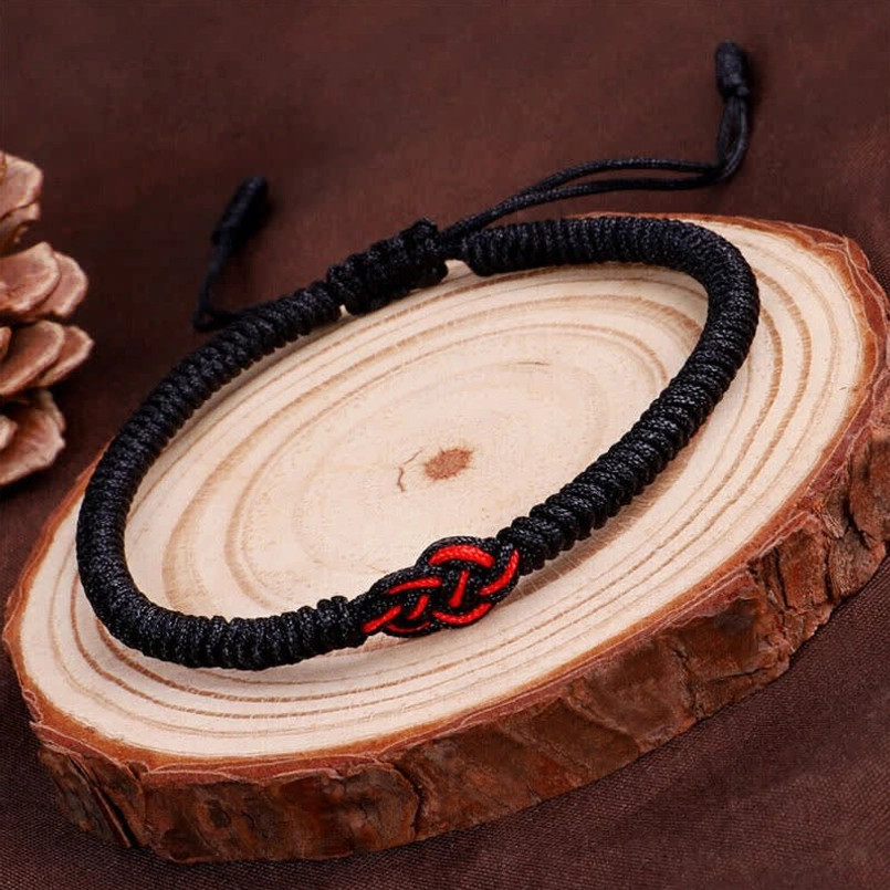 Handmade Tibetan red string bracelet with authentic Buddhist blessing and mantra symbolism