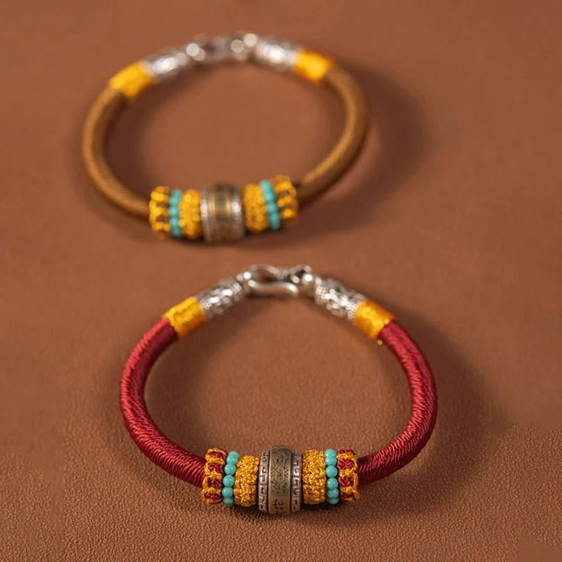 Two Tibetan woven amulet bracelets red and brown style with matching metal charms