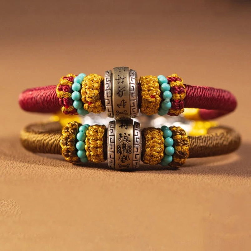 Tibetan protection bracelet King Kong Knot with traditional metal charm and woven cord