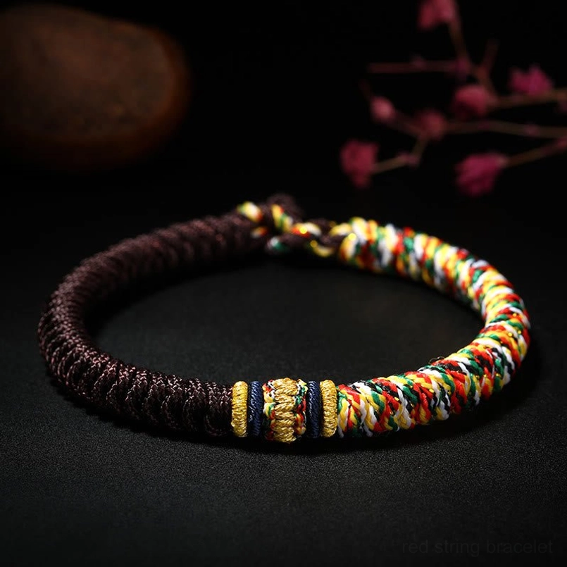 Dark brown Tibetan King Kong Knot bracelet with multicolor woven decorative segments