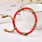 Red adjustable handmade Tibetan King Kong knot protection bracelet with multicolor blessing cord details