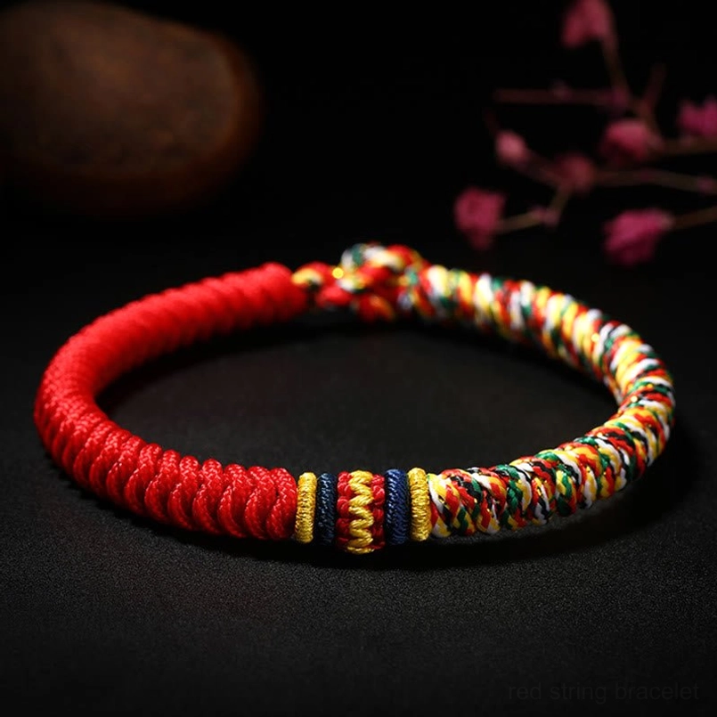 Handmade Tibetan King Kong Knot red string bracelet with multicolor braided accents and floral styling