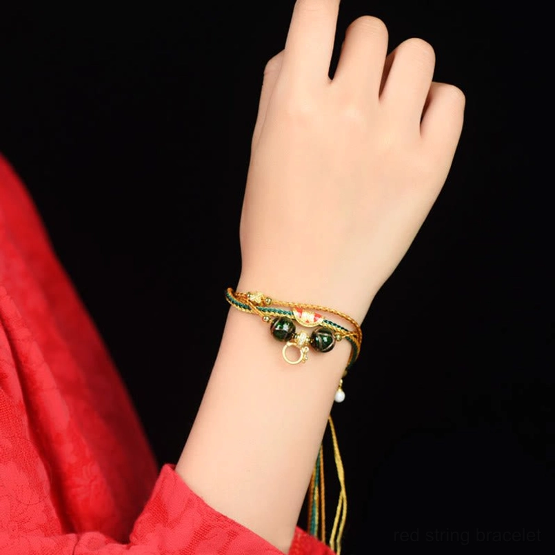 Tibetan liuli glass healing bracelet worn on wrist with natural fit and gold-green color scheme