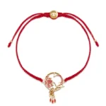 Tibetan lotus koi fish red string bracelet with gold charm on white background - front flat lay view
