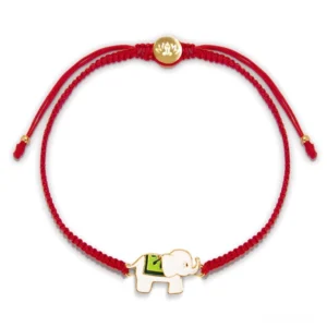Tibetan lucky elephant red string bracelet flat lay with gold metal clasp on white background