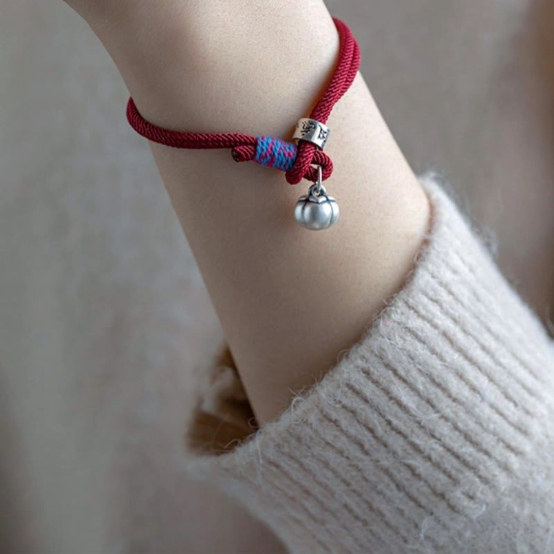 Tibetan lucky bracelet with red cord and silver charms spiritual protection accessory