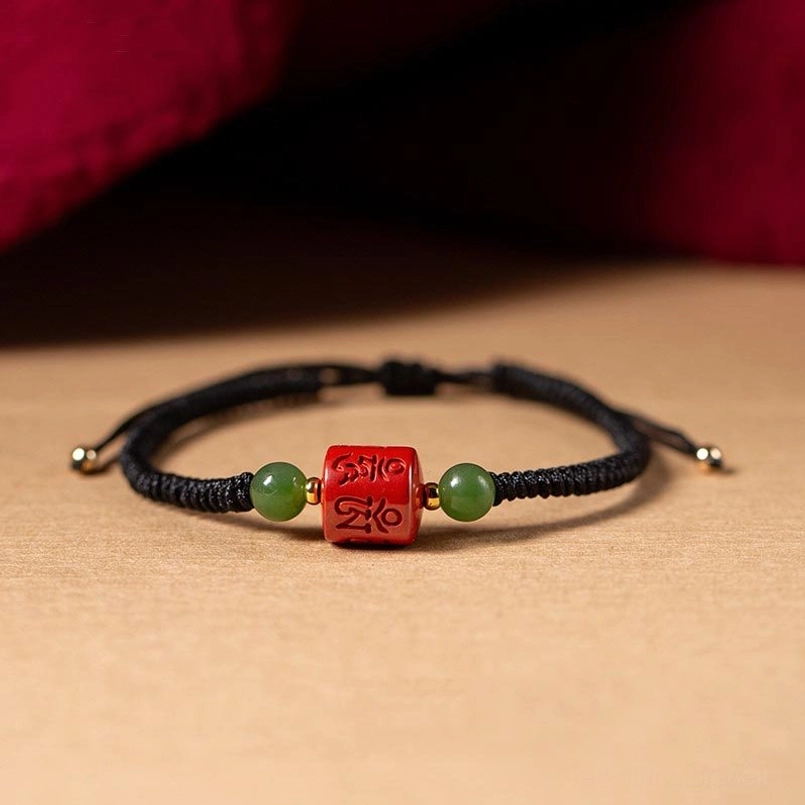 Black rope Tibetan mantra bracelet with cinnabar om mani padme hum bead and jade accents