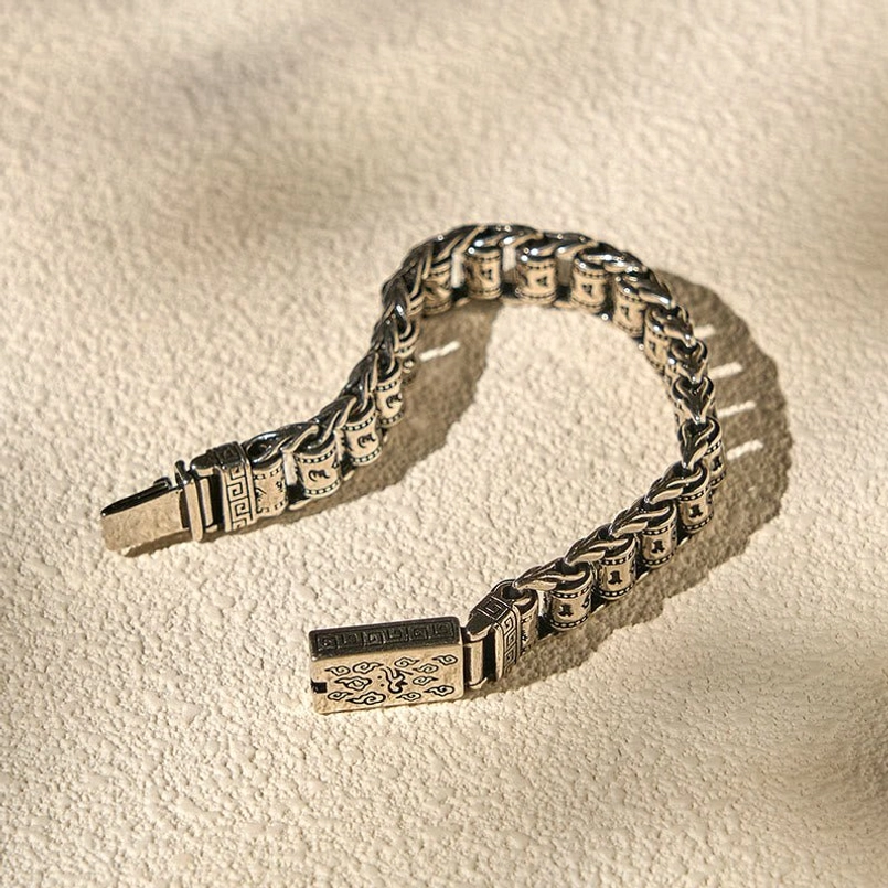Tibetan Om Mani Padme Hum copper bracelet twisted chain design on fabric