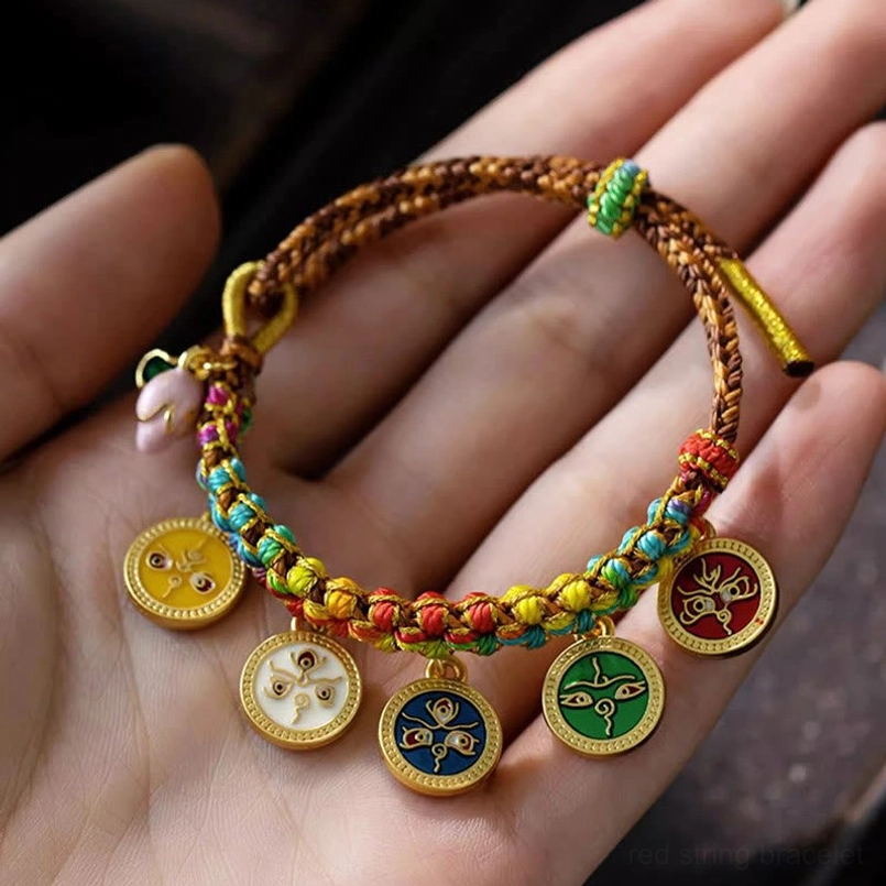 Five God of Wealth bracelet with braided rope and multiple enamel pendants on human palm