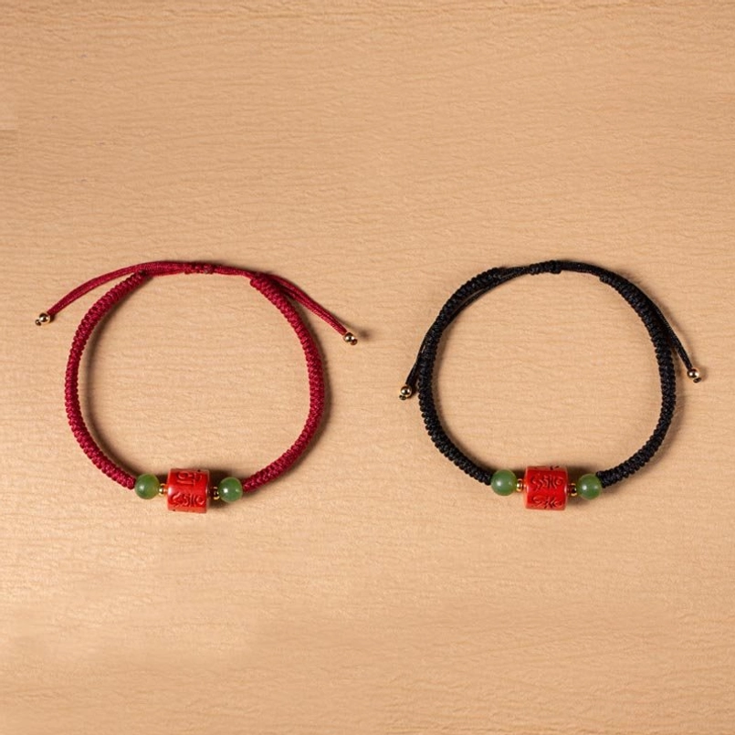 Tibetan protection bracelet with om mani padme hum mantra, cinnabar and jade materials
