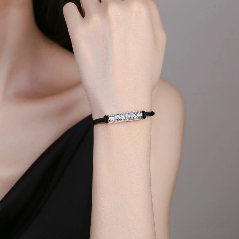 Tibetan protection bracelet worn on wrist showing adjustable fit and slim silver metal hardware