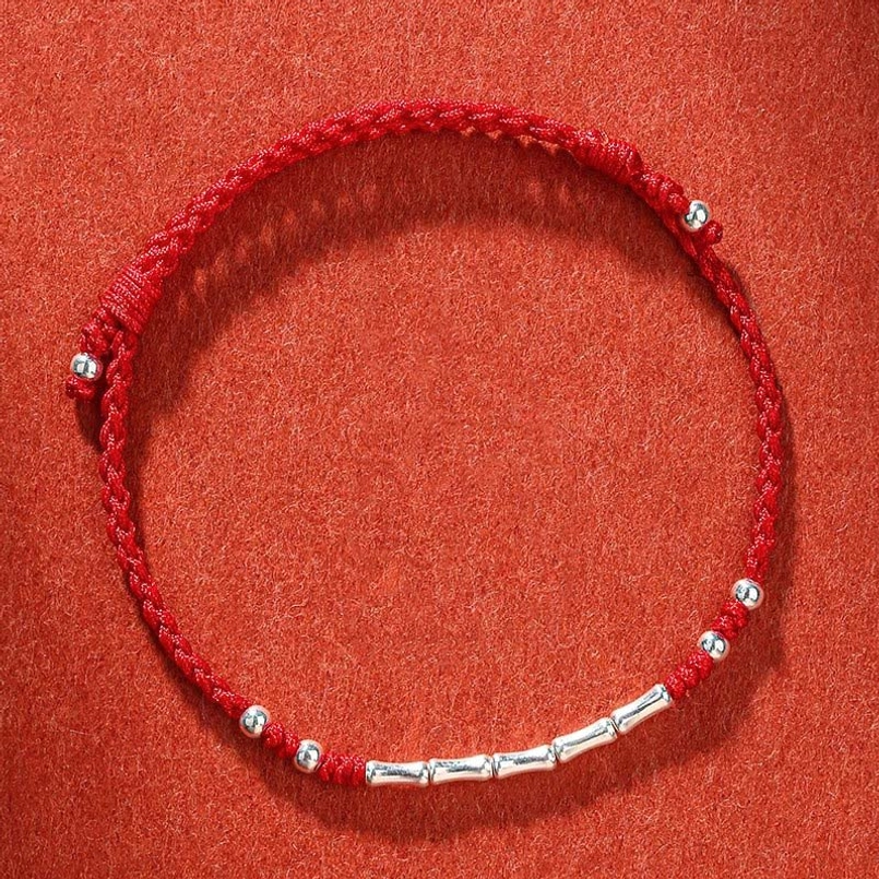 Classic red Tibetan handmade bamboo protection bracelet with metal beads and adjustable closure