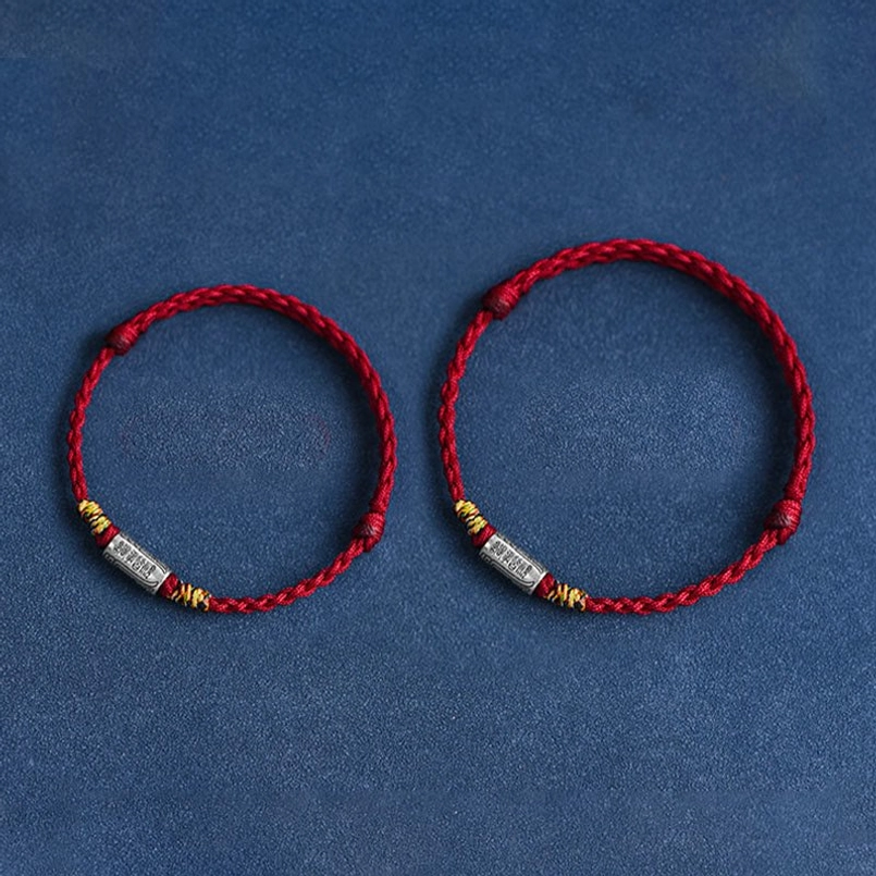 Red string bracelet with sterling silver charm Tibetan Buddhist protection tradition