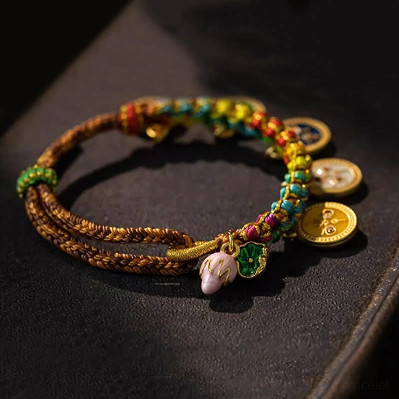Tibetan fortune bracelet with twisted rope and gold round pendants featuring enamel charms