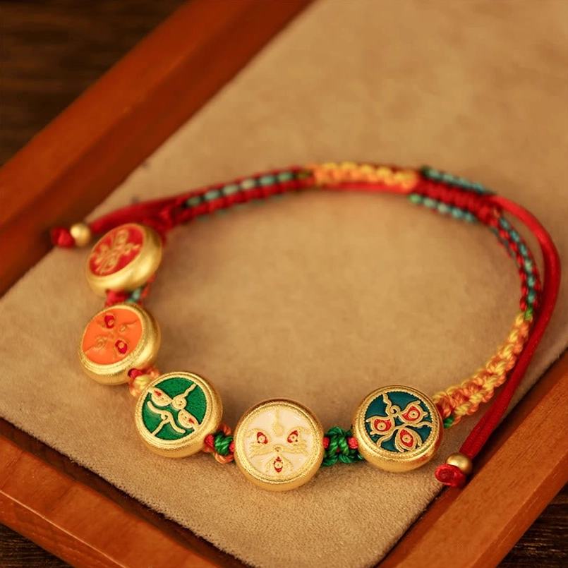 Tibetan Five Gods of Wealth bracelet close-up showing multicolor woven cord with five unique enamel round charms