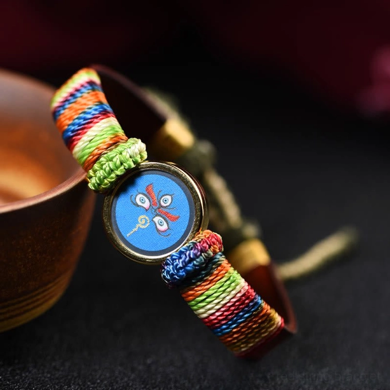 Tibetan wealth gods Buddha eye bracelet with intricate woven band design