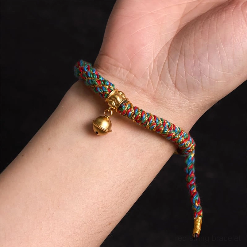 Adjustable Tibetan amulet bracelet with gold charm - wearable on-wrist demonstration