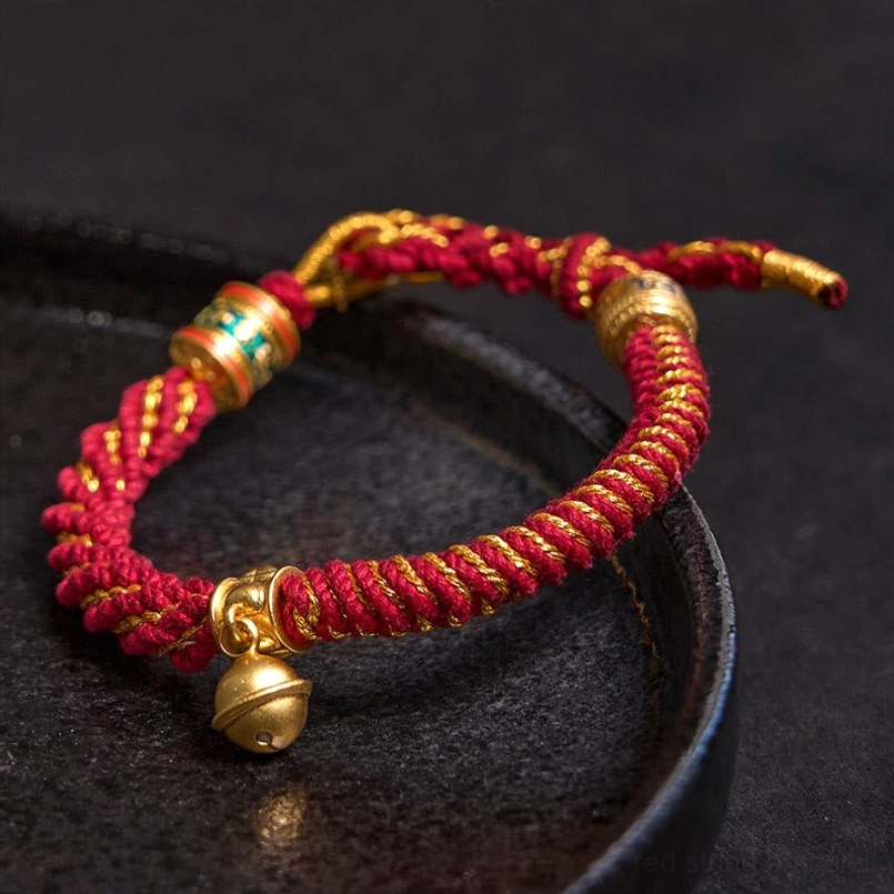 Handcrafted Tibetan string bracelet with brass accents - artisan detail view