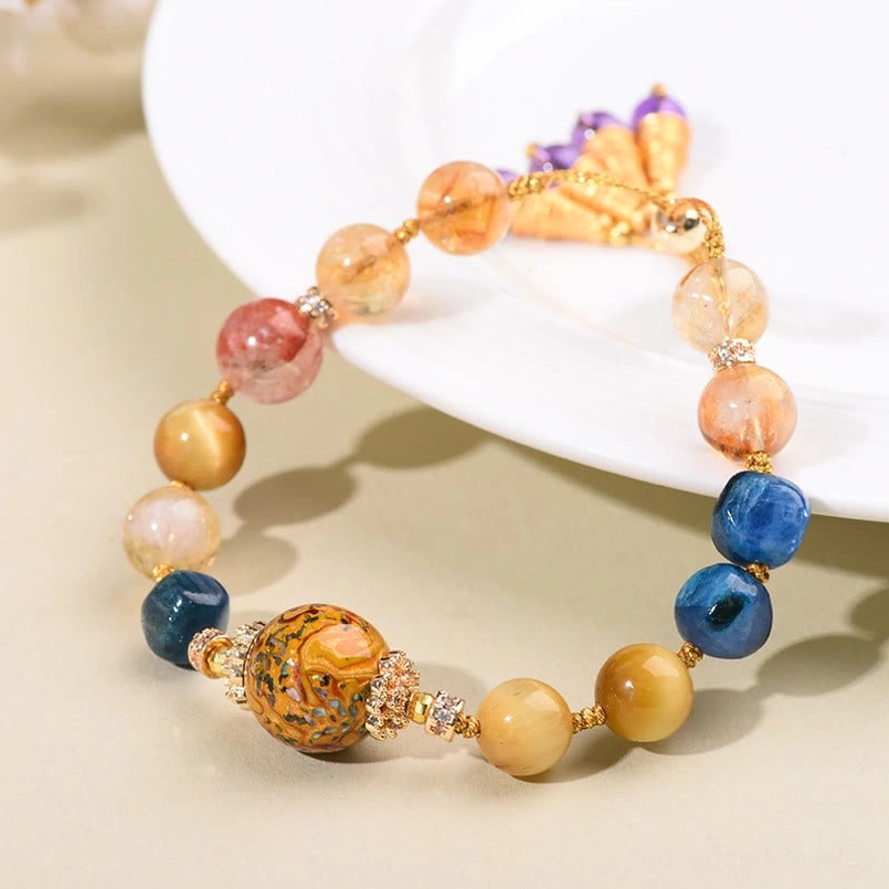 Tibetan lacquer bracelet side view showing full bead arrangement and adjustable gold hardware