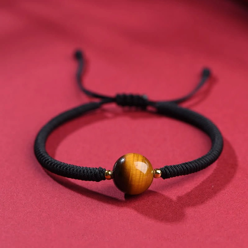 Black rope tiger eye bracelet with 10mm single bead showing alternative cord style