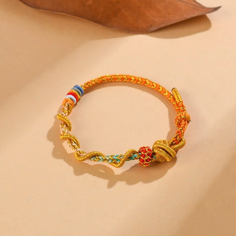Traditional red string fate bracelet with Snake Year symbolism and protective knot