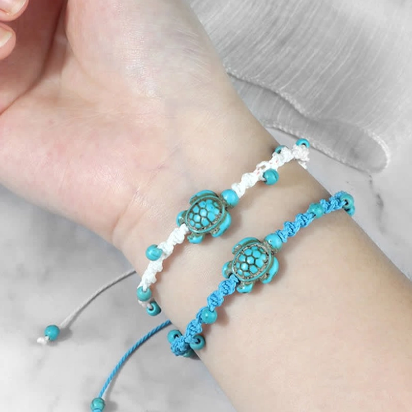 Turquoise turtle protection bracelet red rope full length view