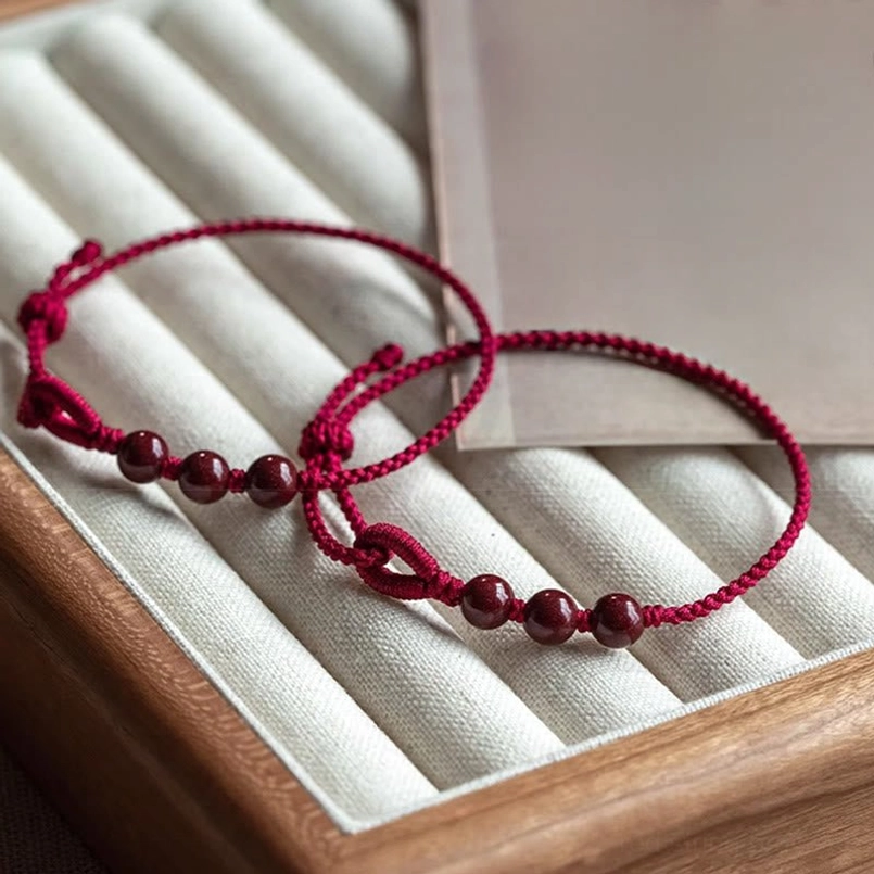 Two matching cinnabar red string bracelets set for couples