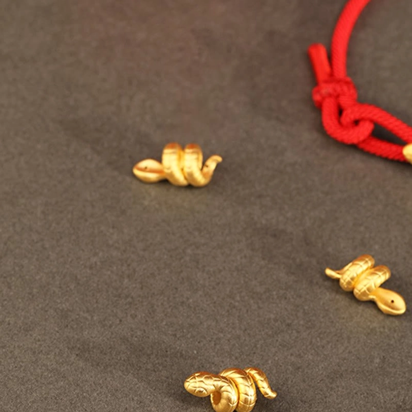 unisex 999 gold snake red string bracelet worn on female wrist