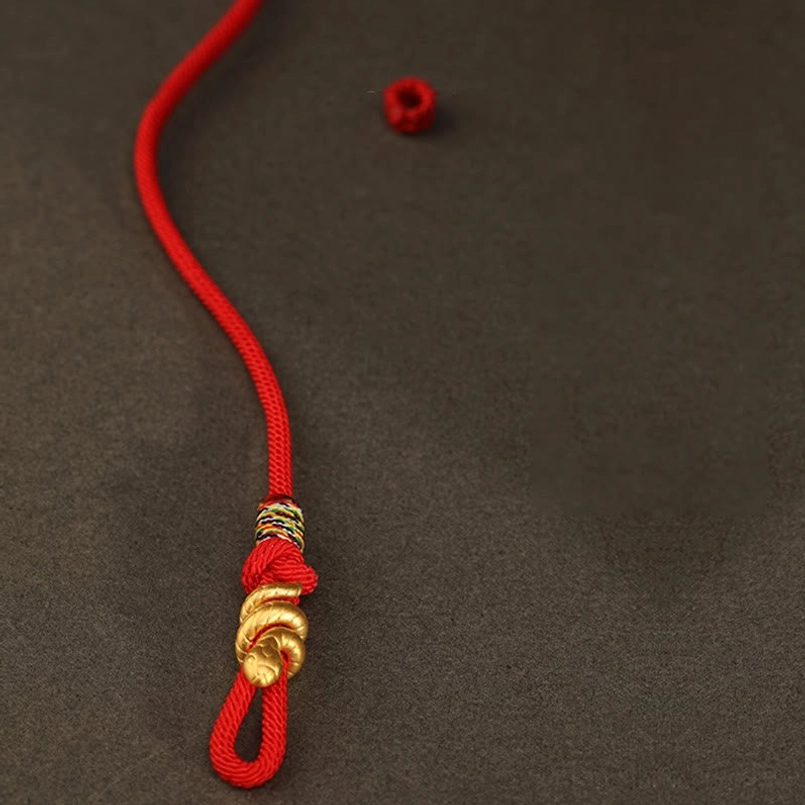 unisex 999 gold snake red string bracelet worn on male wrist