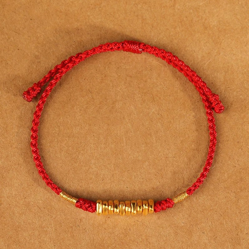 Vibrant red braided string bracelet fine gold pieces