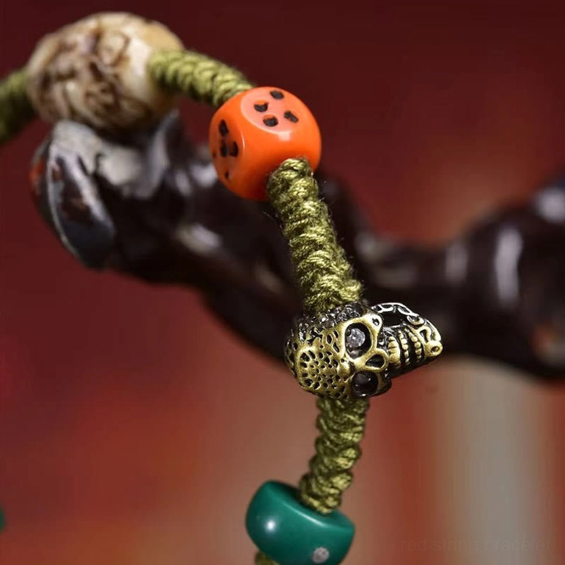 Macro view of vintage copper and bone beads on Tibetan dragon bracelet