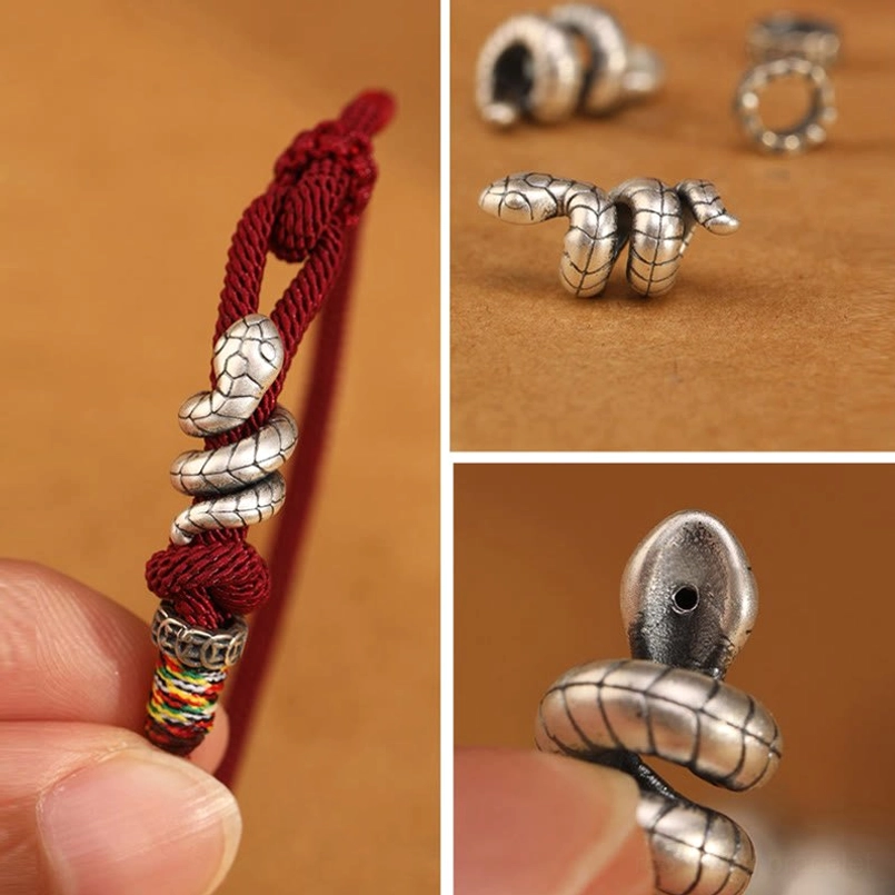 Vintage-style silver snake bead charms and metal rings, multiple angles close-up view